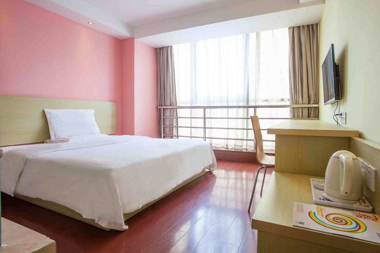7 Days Inn Yangjiang Xinyue International Studio Rum bild